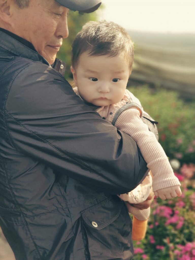 Grandparents carrying Yans, photo 2